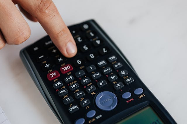 person using a calculator